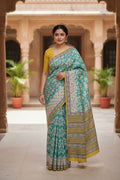 🌿 Teal Green Printed Cotton Saree with Yellow Border